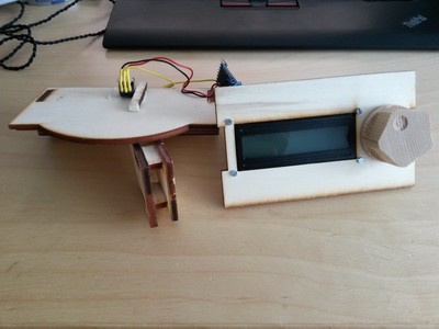 The plywood paddle prototype, including a controller